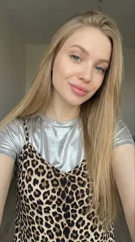 Close-up Selfie of a Young Woman with Leopard Print Top