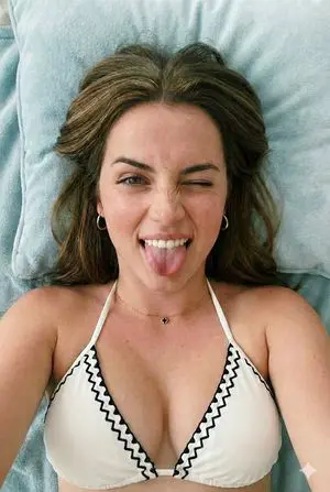 Close-up Portrait of a Playful Young Woman Lying Down