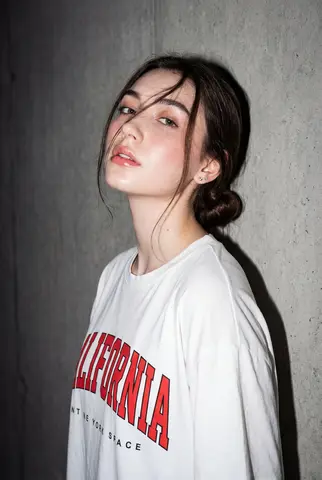 A high-resolution, close-up editorial-style portrait of a young woman
