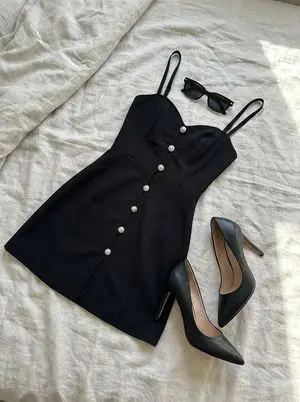 Clothing laid out separately on a bed