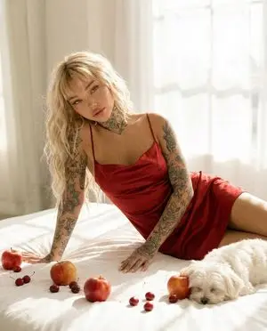Tattooed Woman in Red Slip Dress Editorial Prompt