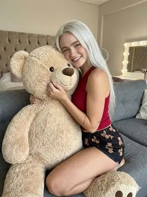 Candid Snapshot Hugging a Giant Teddy Bear