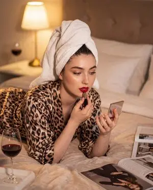 Cinematic Glamour Portrait Applying Lipstick
