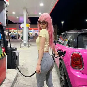 Exaggerated Curvy Figure at Gas Station