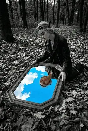 Surreal Black and White Forest Scene with Color Reflection
