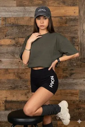 Latina Model in Distressed Denim and Wood Background