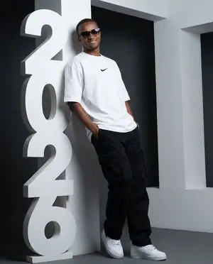 Low-Angle Streetwear Portrait with Architectural Text