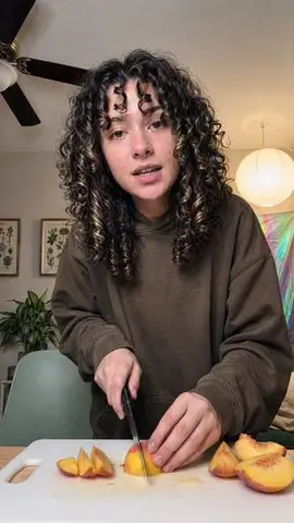 Cozy Indoor Peach Slicing Portrait