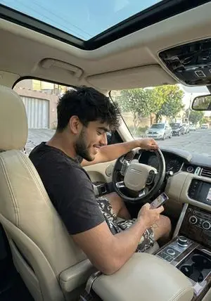 Casual Young Man in Luxury Car Interior