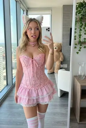 Mirror Selfie of Sydney Sweeney in Pink Gingham Corset