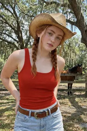 Rustic Red Cowgirl Portrait in Countryside