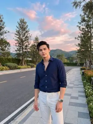 Stylish Man on Sidewalk at Sunset