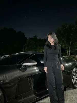 Nighttime Portrait with Luxury Car