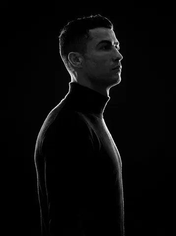 A minimalist black and white cinematic portrait featuring two