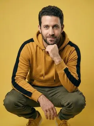 Ultra-Realistic Studio Portrait of Man in Mustard Hoodie