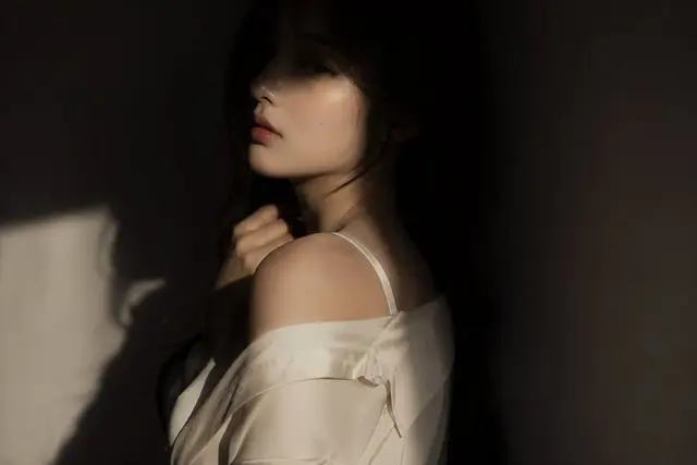editorial portrait, Korean female idol, subtly sensual outfit: silk