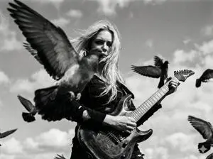 Cinematic Black and White Photo of Woman with Guitar and Pigeons