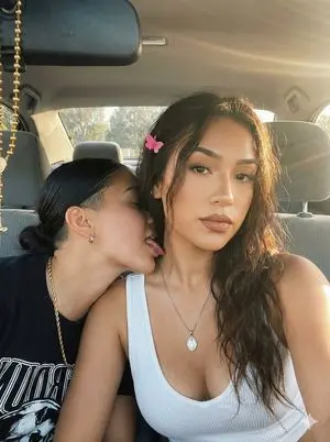 Intimate Car Selfie with Two Women and Golden Hour Lighting