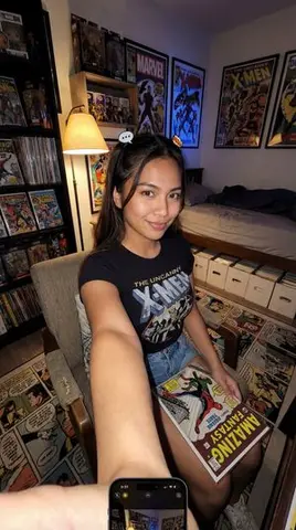 Filipina Comic Geek Selfie in Collector's Room