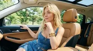 Sydney Sweeney in Denim Corset in a Luxury Car