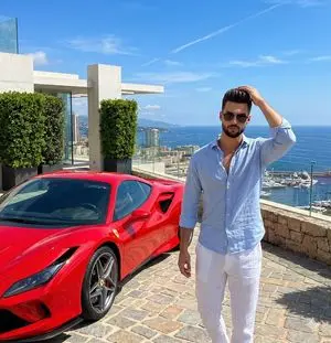 Luxury Lifestyle Photography Prompt: Man with Red Sports Car