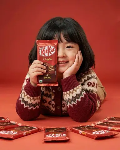 A cute young girl with short black hair and