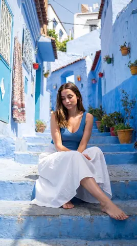 Female Seated on Steps with One Leg Bent and the Other Extended