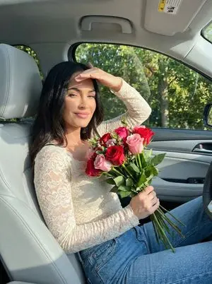 Megan Fox Candid Car Photo with Flowers