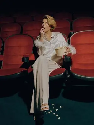 Elegant Fashion Editorial in a Dark Movie Theater